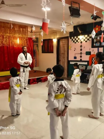 The examiner addresses the students before the color belt promotion test begins. We explain the process to ensure students are prepared and confident.