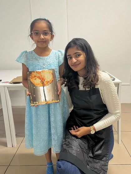 A young artist and I, posing with her completed gold foil artwork. I love seeing creators of all ages fall in love with this technique.