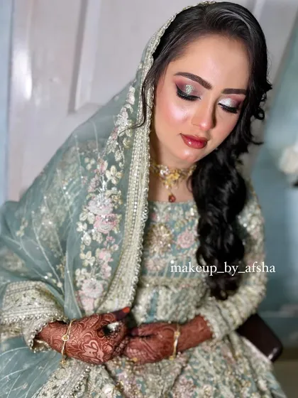 A beautiful pastel green outfit called for a fresh and dewy makeup look. I used soft pink and silver tones on the eyes to complement the embroidery on her dress.