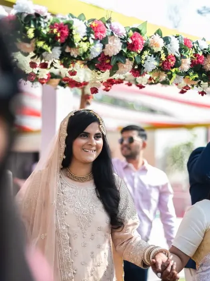 The bride's entry, holding her father's hand, a poignant and emotional moment.
