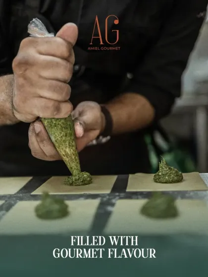 The art of pasta is in the details. I handcraft each tortellini, filling delicate pasta sheets with flavorful, gourmet fillings like this vibrant green pesto, ensuring every bite is authentic and melts in your mouth.