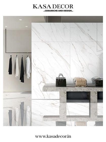 A retail space featuring our nature-inspired tiles. The large-format, white marble-effect tiles create a clean, luxurious, and bright environment.