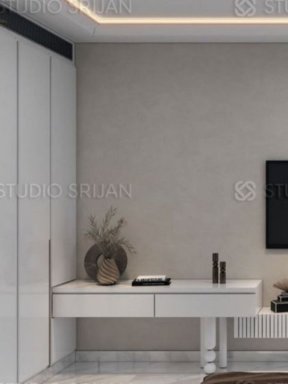 A minimalist vanity or desk area is seamlessly integrated into the wall, maintaining the room's clean and uncluttered feel.