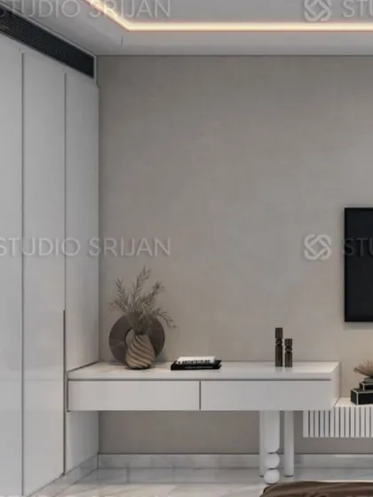 A minimalist vanity or desk area is seamlessly integrated into the wall, maintaining the room's clean and uncluttered feel.