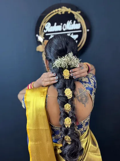 Professional hairstyling is a key part of my course. Here, you can see a traditional South Indian bridal braid, beautifully decorated with fresh flowers and hair accessories, a skill that is in high demand.