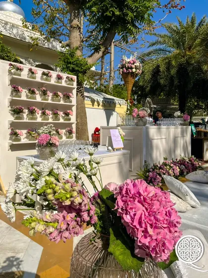 I created this 'Floral Wine Library' for a Mehendi event. The bar area features a wall of fresh flowers in small vases, combining the love for wine and florals in a unique and interactive way.
