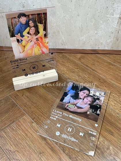 A modern way to cherish a memory. These acrylic plaques feature your favorite photo and a scannable code for a special song, creating a beautiful and interactive keepsake.