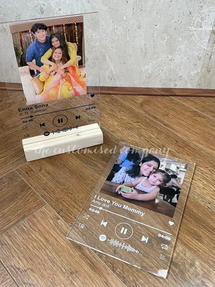 A modern way to cherish a memory. These acrylic plaques feature your favorite photo and a scannable code for a special song, creating a beautiful and interactive keepsake.