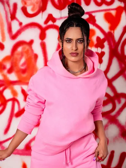 A close-up of the graffiti-chic look, showing the details of the makeup and hairstyle against the chaotic, colorful background. This demonstrates the set's effectiveness even for tighter shots.