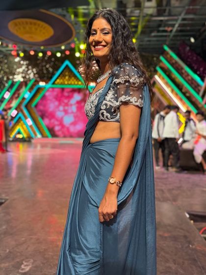 A candid smile on the set of the reality show. Even during long shooting schedules, I believe in maintaining a positive and energetic presence.