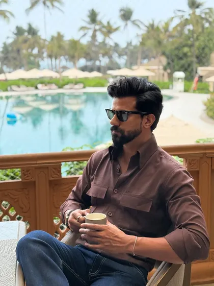 Enjoying a coffee by the pool, our client looks effortlessly stylish in the brown double-pocket shirt, paired with classic blue jeans.