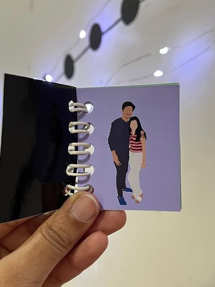 A simple, sweet couple portrait inside the mini booklet keychain.