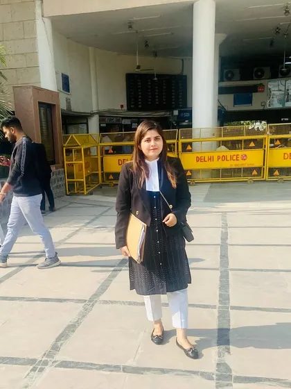 In my uniform of black and white outside the Delhi Police headquarters, a common stop in matrimonial disputes.