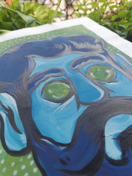 A different angle of my mixed media self-portrait, showing the texture of the paint and brush pen on paper.