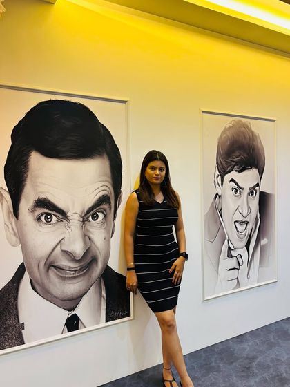 A guest posing next to the fun and quirky art in our hallway. I’ve added these touches to make the entire space feel unique and entertaining.