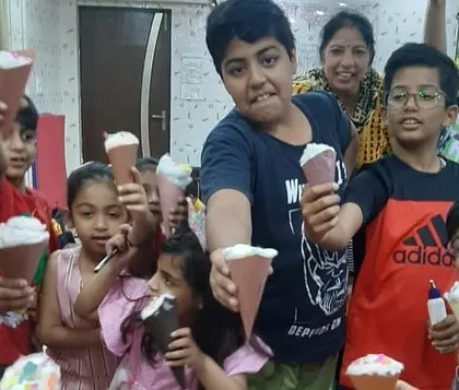 More happy faces with their paper ice cream cones. It’s a sweet ending to a fun-filled day of activities at the summer camp.