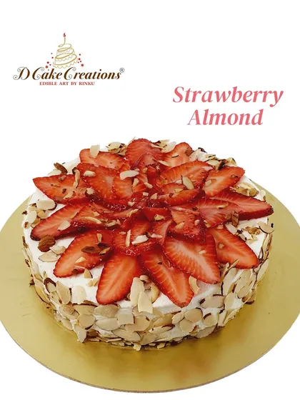 A delicious strawberry almond cake, featuring a ring of toasted almonds and a topping of fresh strawberries.