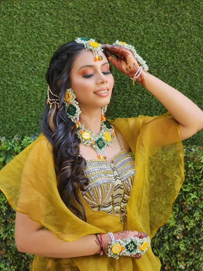 A full view of the mehendi outfit, showing the stylish cape and printed skirt. It's a comfortable, chic, and photo-ready choice for your special day.