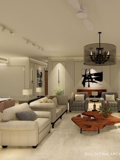 We designed this expansive living and dining area with a neutral color palette to create a calm and sophisticated environment. The space features plush sofas, a live-edge wooden coffee table, and carefully selected art to add character.