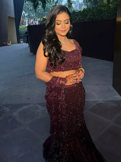 A full shot of Himanshi's Roka glam. The soft smokey eye and radiant skin create a look that is both elegant and celebratory.