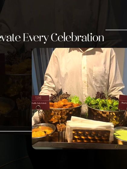Elevate every celebration. A server presents a tray with our signature Basil Paneer Tikka and Truffle Dahi Kebab, demonstrating how we offer sophisticated and delicious options for any event.