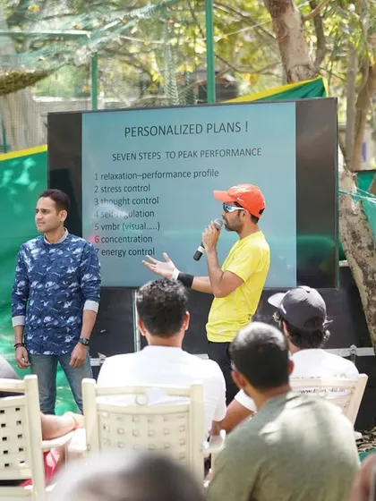 Presenting on personalized performance plans during a coaching event. My methods are based on proven, structured approaches used at the highest levels of the sport.