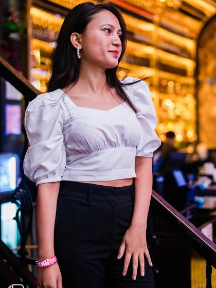 A guest posing on the stairs.