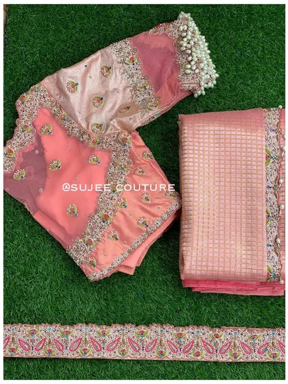 The complete set for the peach blouse, including the matching saree fabric and the embroidered paisley border, showing how the entire look is coordinated.