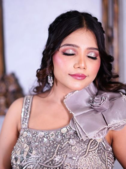 A close-up on the soft, shimmery eye makeup that complements the gown perfectly.