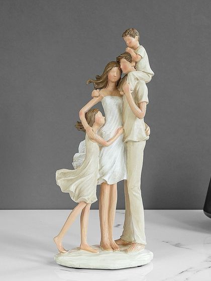 A loving family of four is beautifully captured in this figurine. The simple, flowing lines and neutral color palette give it a timeless quality, celebrating the heart of the home.