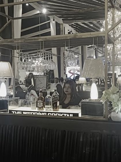 A black and white photo showcasing the structure and form of one of our intricate bar designs, emphasizing the elegant lines and lighting.