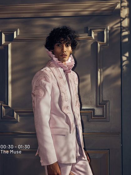 From my 'The Muse' series, this soft pink jacket with a ruffled collar is where style and energy meet. It is a look for an evening that blooms with exalting flair.