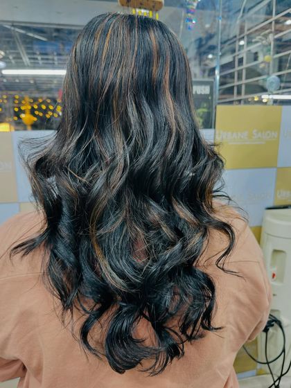 The full look from the back. The highlights are blended perfectly for a natural, yet enhanced, appearance.