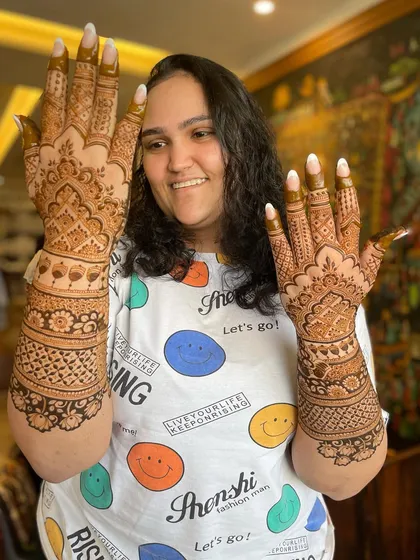 The smile of a satisfied client is everything. I love it when my clients are happy with their bridal mehendi.