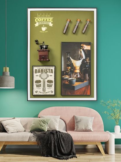The Coffee Legacy shadow box is a tribute to all things coffee. It includes a miniature vintage grinder, vials of real coffee beans, and framed coffee-themed art, making it perfect for a kitchen or cafe.