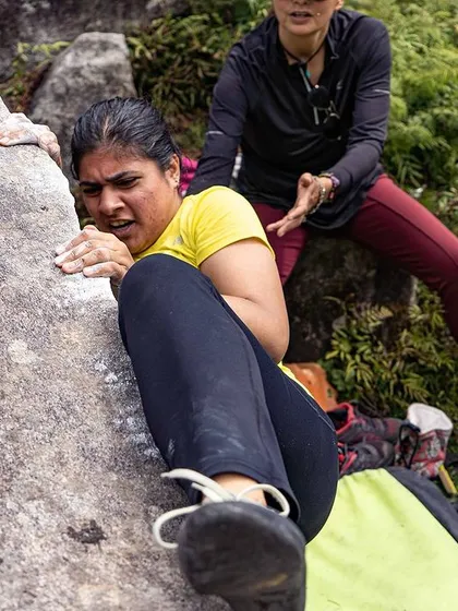 The intensity and focus in this climber's expression show how engaging bouldering can be.