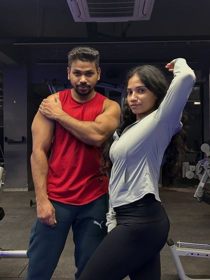 Sharing a flex and a smile. Every workout is a step forward in our journey together.