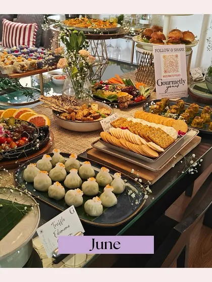 A beautiful grazing table from a June event, featuring Truffle Edamame dim sum and other Asian-inspired delights. This spread highlights our ability to create diverse and delicious menus.