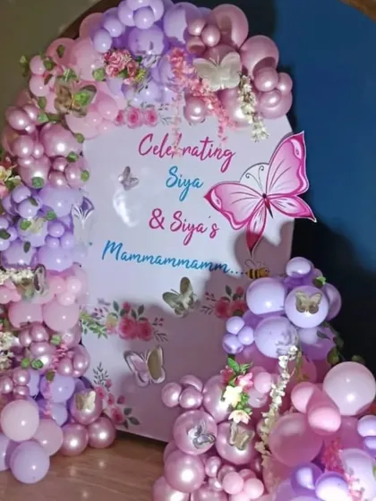 A joint celebration for Siya and her grandmother with a lovely butterfly theme. The decor uses shades of pink and purple balloons with delicate butterfly accents.