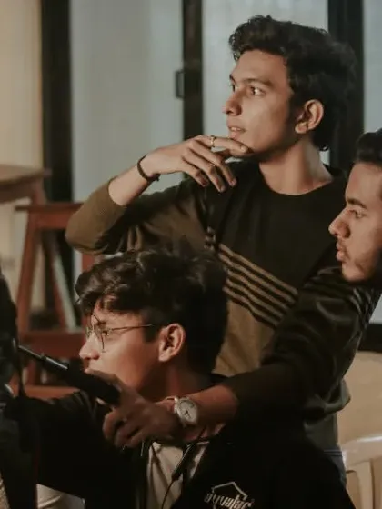 Another view of the team collaborating, showing the dynamic of a multi-person shoot.