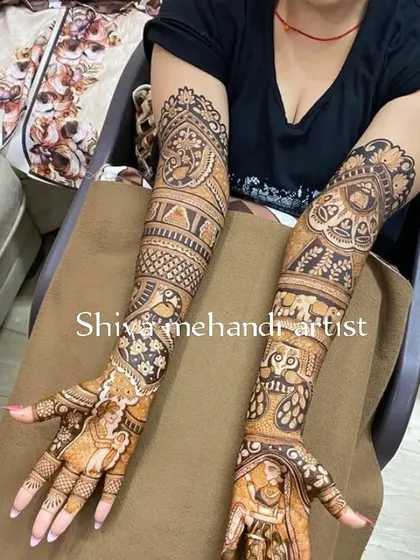 A full-sleeve design filled with classic Indian art elements. It features a bride in a doli, elephants, peacocks, and intricate geometric patterns.