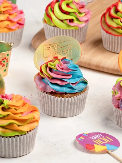 A group of colorful Holi-themed cupcakes. Shooting multiple products together is a great way to showcase a full collection or range.