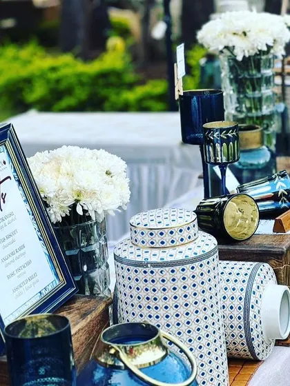 Setting up for a beautiful outdoor event just outside Mumbai. The blue and white decor, paired with fresh flowers, created a stunning dessert station for guests to enjoy.