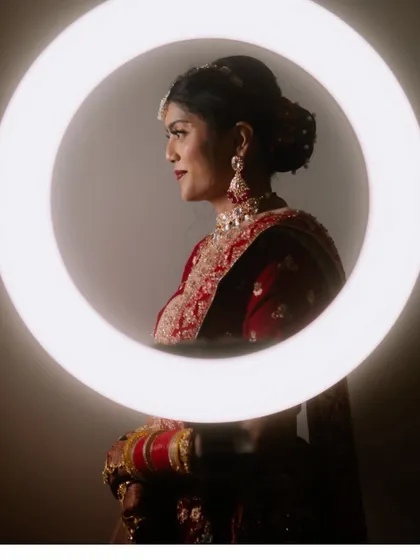 A creative and modern bridal portrait using a ring light to create a stunning halo effect.
