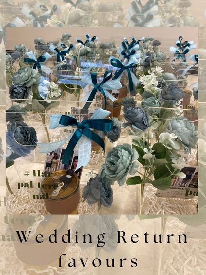 A collection of our modern acrylic wedding return favours, showcasing the elegant presentation with teal ribbons and floral accents.