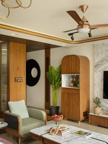 The curved-edged bar unit, an accessory-like element that adds both function and style to the living room.