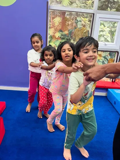 A human train chugging along. This fun group activity teaches children to work together and coordinate their movements, building camaraderie and a sense of team spirit.