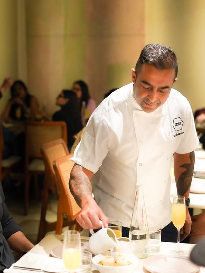 Our talented chef, Sunil, in action during the collaborative dinner with Chef Sid Sahrawat. His passion and expertise shine through in every dish he creates.