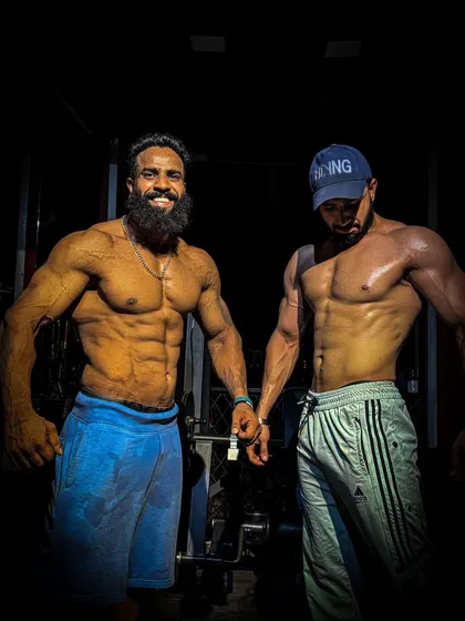 Two of my athletes motivating each other. The team environment is crucial for pushing through the toughest days.