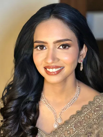 My beautiful reception bride, looking radiant and happy. I created a soft glam look with a focus on luminous skin, subtly defined eyes, and a warm, glossy lip.